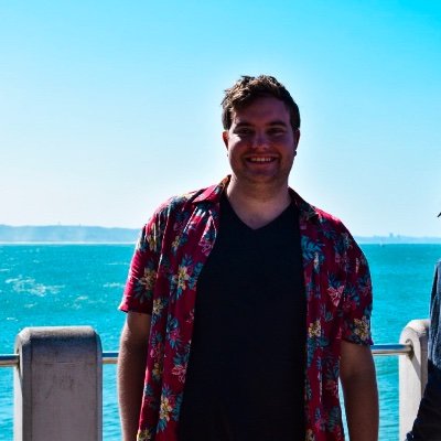 Matt Loder outdoors beside the sea